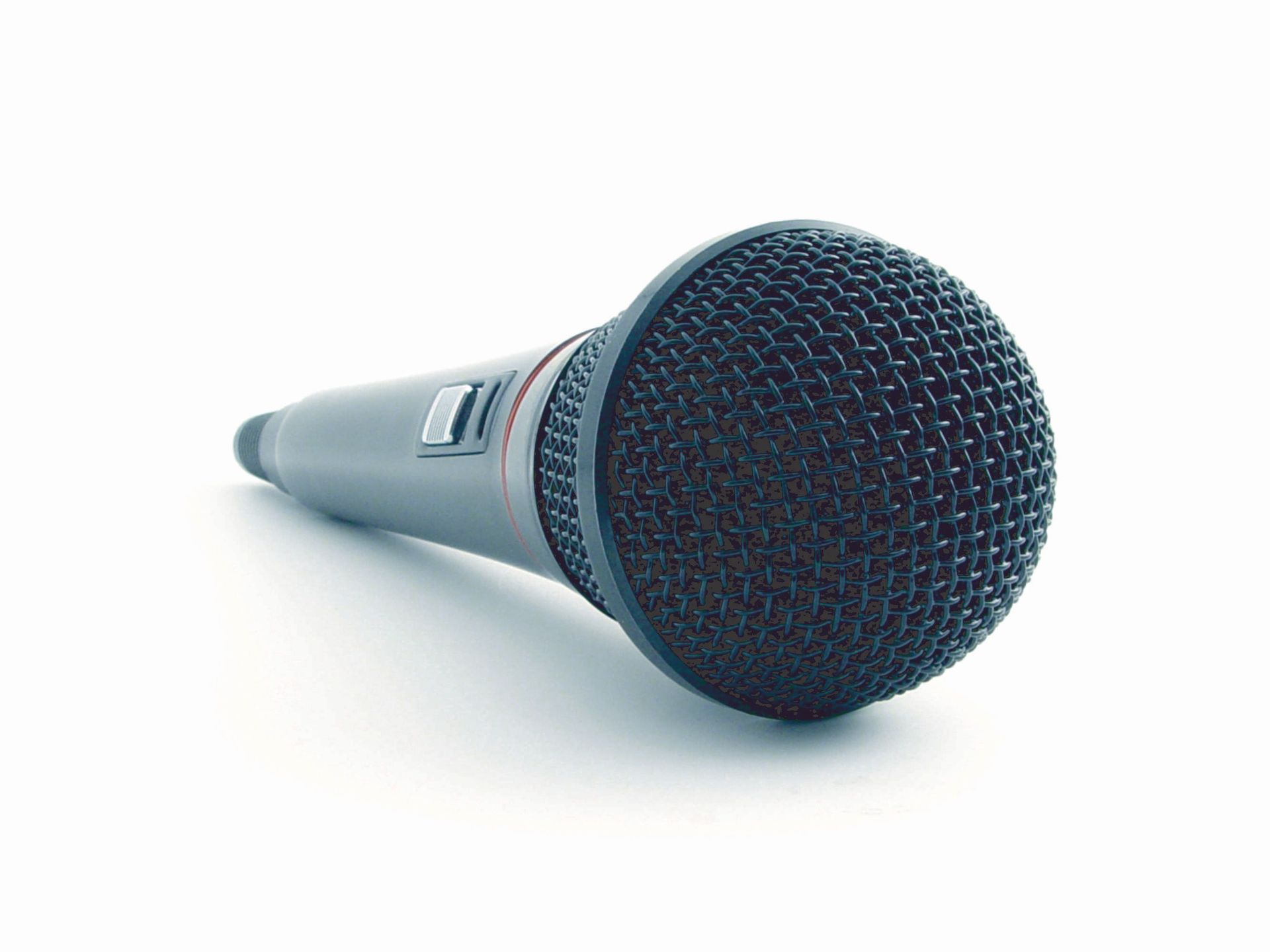 Close-up of a condenser microphone illustrating sound recording equipment in a studio setting.